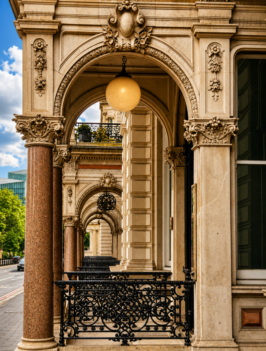 Ornate historic arches and decorative columns creating a repeating architectural perspective